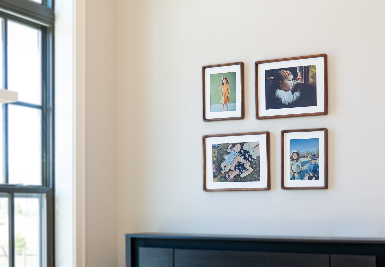 A gallery wall mixing Wallie 10-inch and 13-inch frames